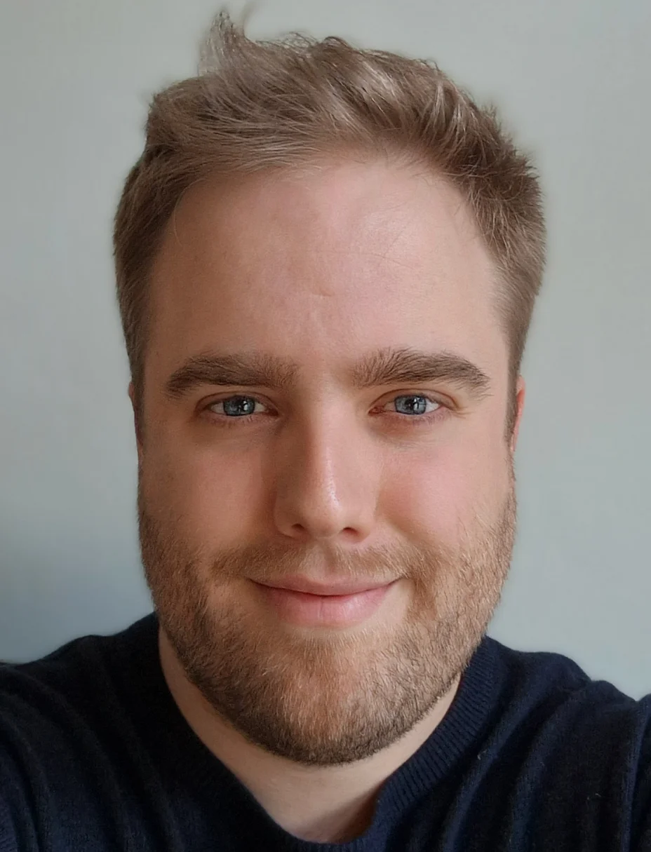 Headshot of a blond man.